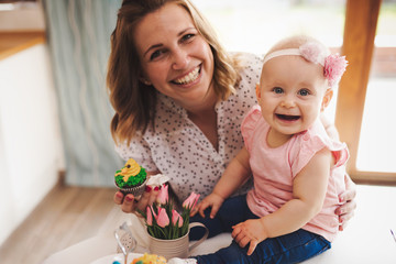 Mother and her baby playing in easter holiday