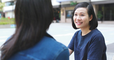 Friends talking to each other at outdoor