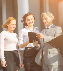 successful business team with tablets on a background of office