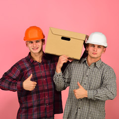 Men stand on pink background, copy space.