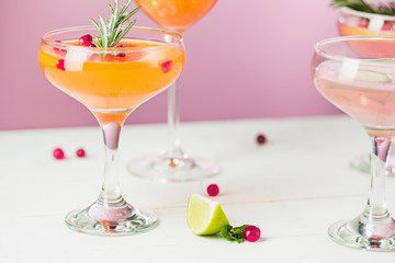 The rose exotic cocktails and fruits on pink