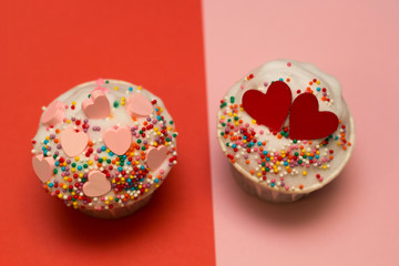 cupcakes  with pink hearts  and red hearts on a red and pink background