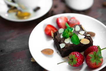 Brownie with Fresh strawberry on white plate