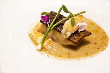 dish with fish broth, fish and shrimp