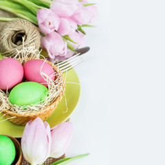 Fototapeta na wymiar Basket with Easter eggs and flowers
