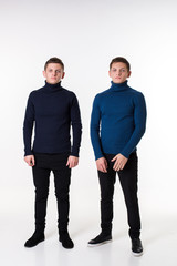 Casual twin brothers. Studio shoton a white background