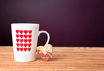 
Mug with hearts on the table