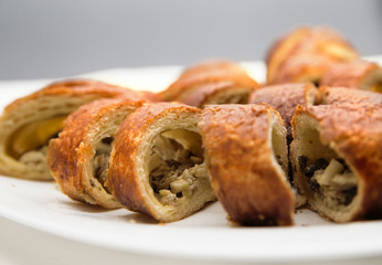 cut pie with mushrooms on a plate