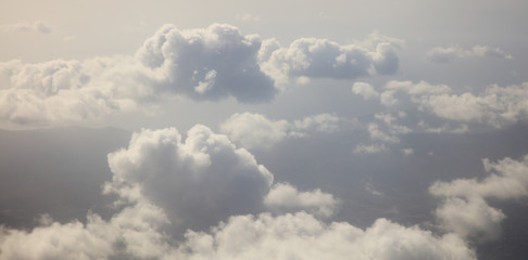 Fototapeta premium Clouds white and grey background. Aerial photo from plane's window