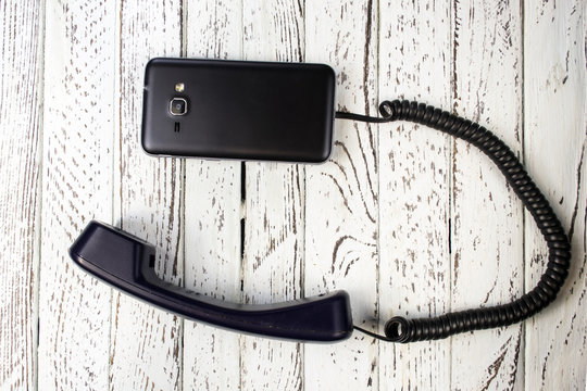 Mobile phone with an old handset. Creative