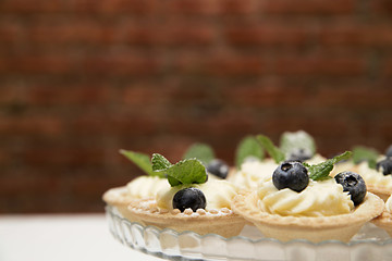 dessert. Baskets with cream and fresh berries