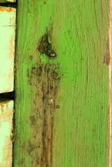 Wood texture with worn and colorful paint, old and neglected wood.