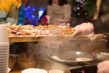 cooking food in the winter outside. A party