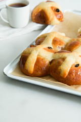 Homemade Easy traditional Hot Cross Buns, perfect for Easter. Toast and spread with butter.