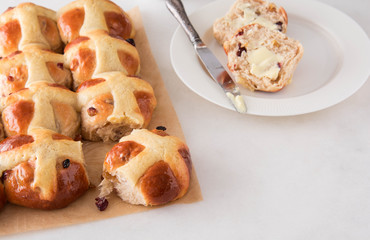 Homemade Easy traditional Hot Cross Buns, perfect for Easter. Toast and spread with butter.