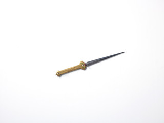 Silver and gold colour antique dagger, white background 