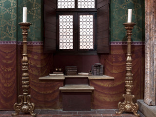 Gold colour candlesticks by window, diorama 