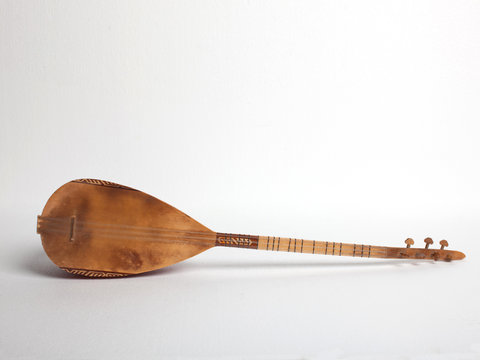 Lute lying on side, front view, white background 
