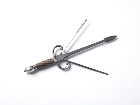 Silver colour three pronged dagger, white background 