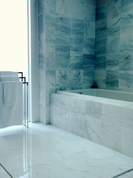 Marble clad bath  and room 
