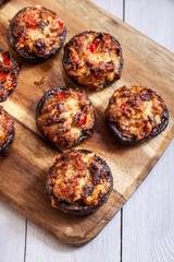 Baked champignon caps stuffed with minced meat