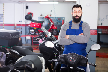 Worker shows a variety of motorcycle