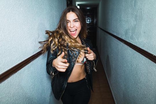 Cheerful woman posing in hall