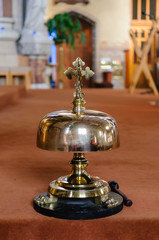 Brass mass bell in a Roman Catholic chapel