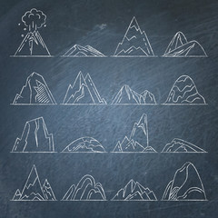 Collection of mountain icons on chalkboard