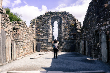 GLENDALOUGH, IRELAND - JUL 26, 2017: Glendalough was an Early Medieval monastic settlement founded in the 6th century by St Kevin.