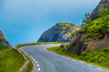 Bicycling across Lofoten Islands, near Nussfjord, Nordland, Norway. 