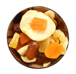 bunch of tutti frutti in wooden bowl on a white background