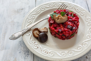 Russian salad vinaigrette with pickled mushrooms.