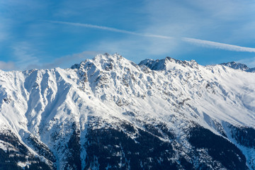 Snowy mountains in the alps with sunshine