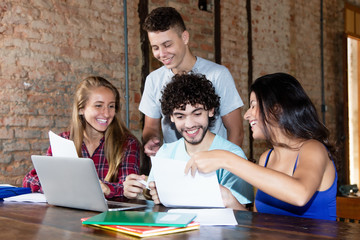 Group of young caucasian students in discussion