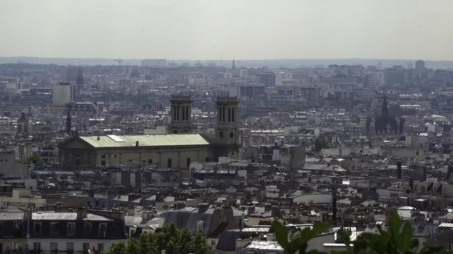 PARIS, FRANCE  – SEPTEMBER 2016 : Video shot over central Paris rooftops on a beautiful day with old temple in view