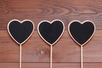 Chalkboard wooden hearts on a long stick for the text