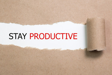 Stay Productive Motivation quote written behind a torn paper