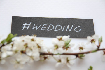 Naklejka premium Spring Flower Background. Wedding text, hand written custom calligraphy isolated on white.