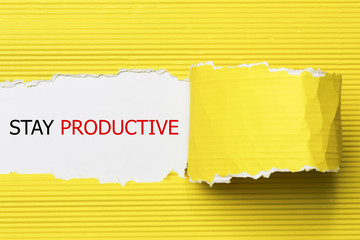 Stay Productive Motivation quote written behind a torn paper