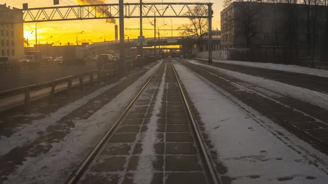 ride on the modern tram through road junction, time lapse