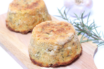 Potato pie with tuna on wooden chopping board