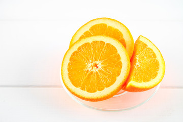 Orange slices on a white wooden table. Healthy food, drinks.