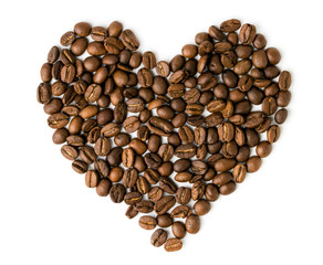 Heart made of coffee grains on a white background.