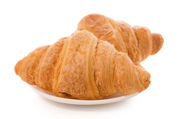 Croissants on a white plate isolated