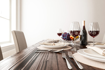 Dining Table with Wine and Empty Plates