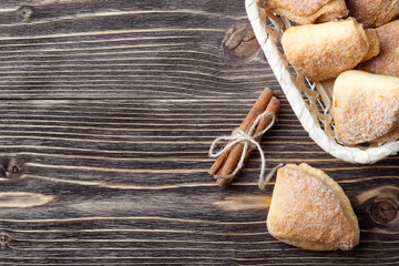Concept menu - homemade patties with cinnamon on a dark wooden background with copy space