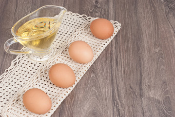 Brown eggs on wooden background