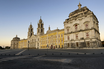 View of the Convent of Mafra at sunset in Mafra, Portugal; Concept for travel in Portugal and most beautiful places in Portugal