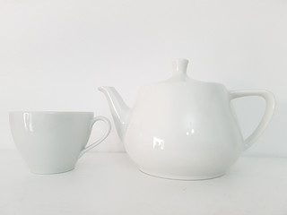 White tea cup and tea pot on white background